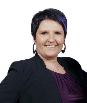 Adriana Skura-Palmer, Co-Founder and COO of TechnoRealism, wearing a black blazer with purple accents